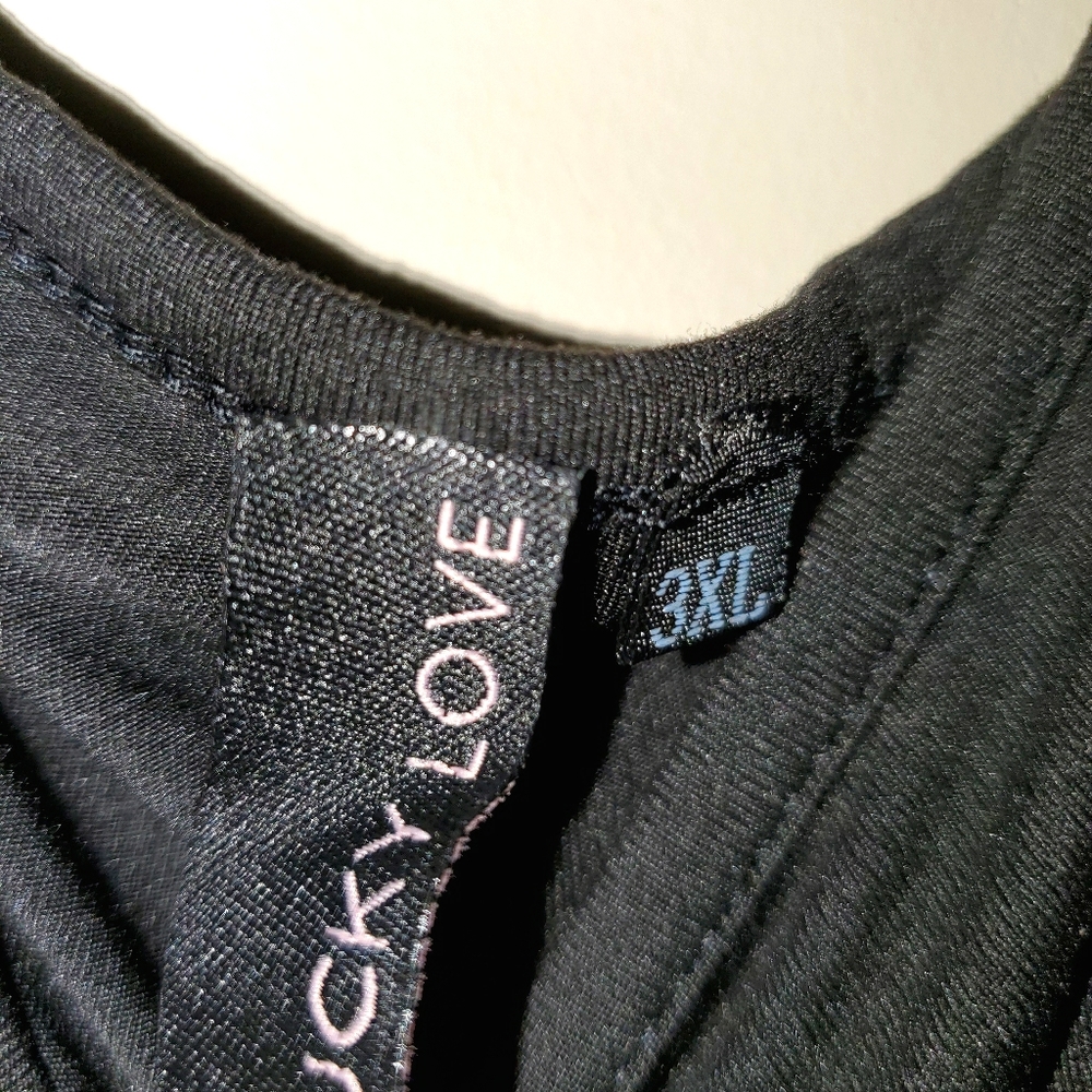 Black tank top with ruffle layers at bottom